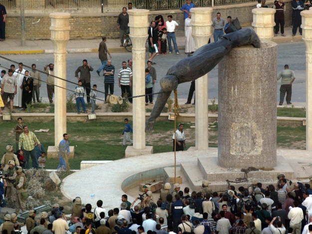 Saddam Hussein's statue hauled down in Baghdad as his regime collapses, April 9, 2003